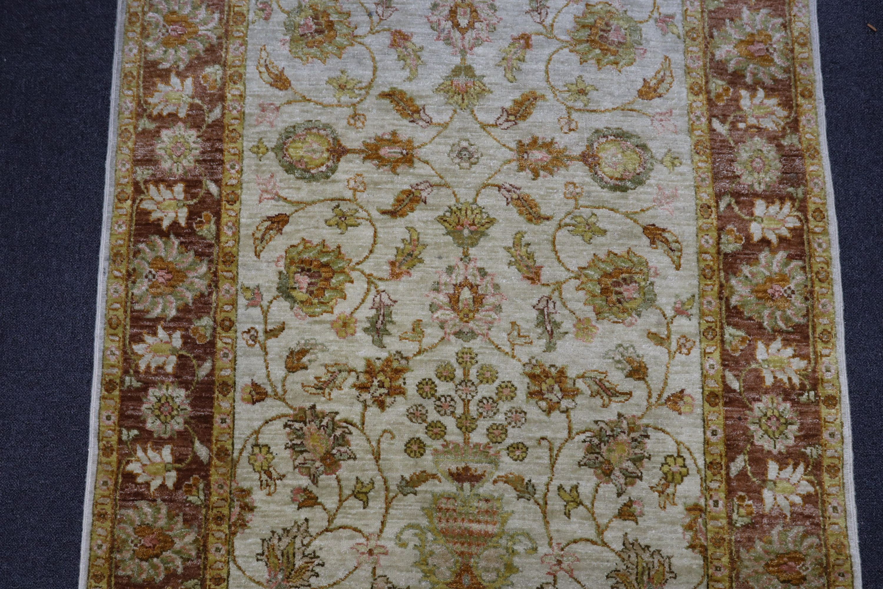 A Ziegler style ivory ground rug, 188 x 122cm